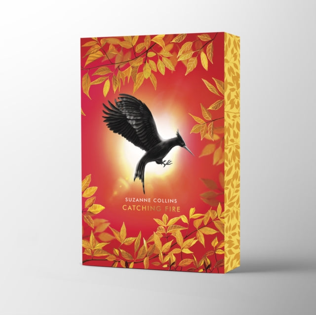 Catching Fire; Suzanne Collins | Paperback Deluxe Sprayed Edge Edition (The Hunger Games Book 2)